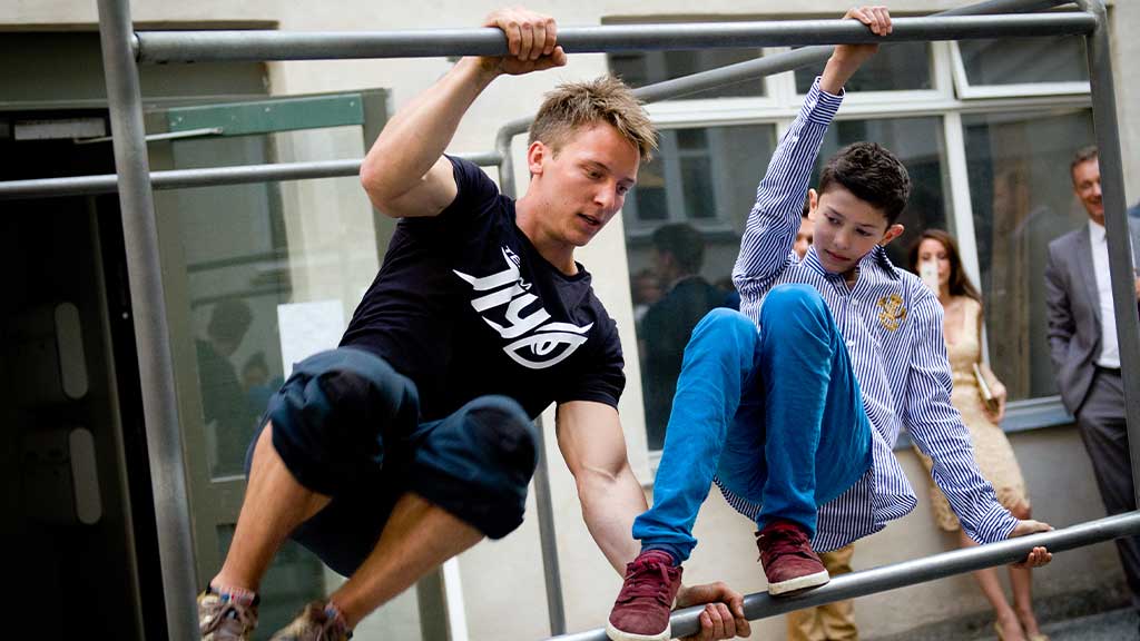 Lasse Hammer from JIYO shows Prince Nikolaj some tricks for Nikolaj's confirmation. The rest of the Royal Family looks on.